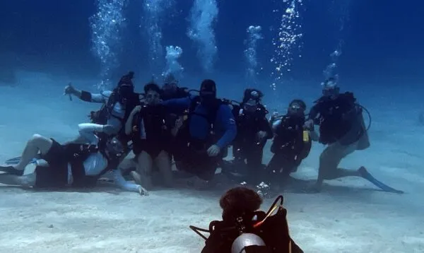 Certified divers on a small-group Roatán reef dive during a cruise stop