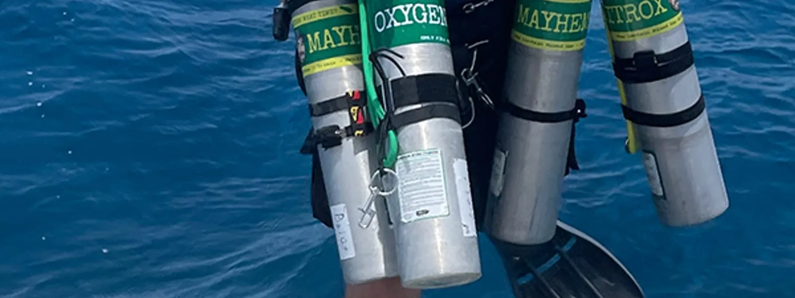 A technical diver exploring Roatán's reef